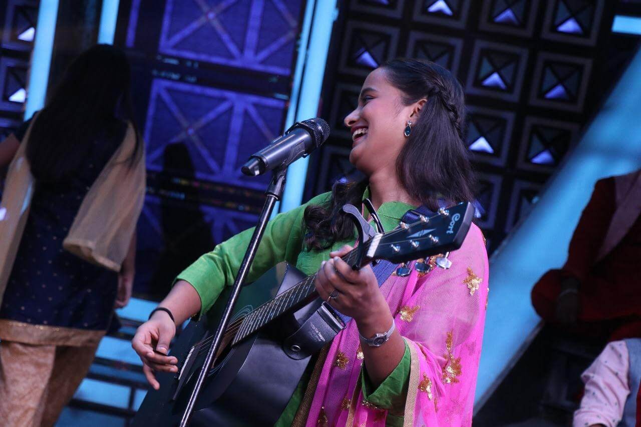 Gauri Tidke performing at an outdoor concert